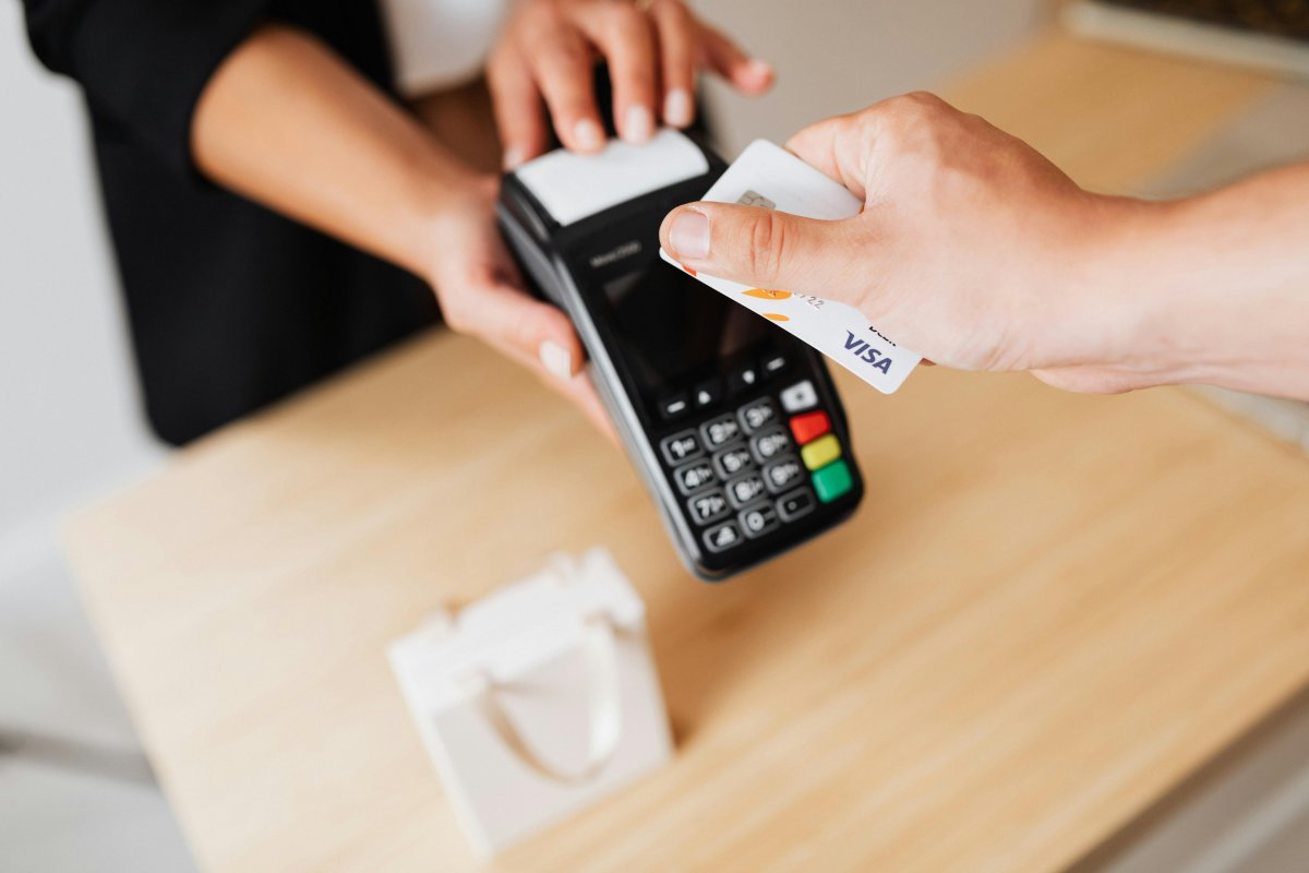 Merchant accepts a smartphone QR payment at the counter